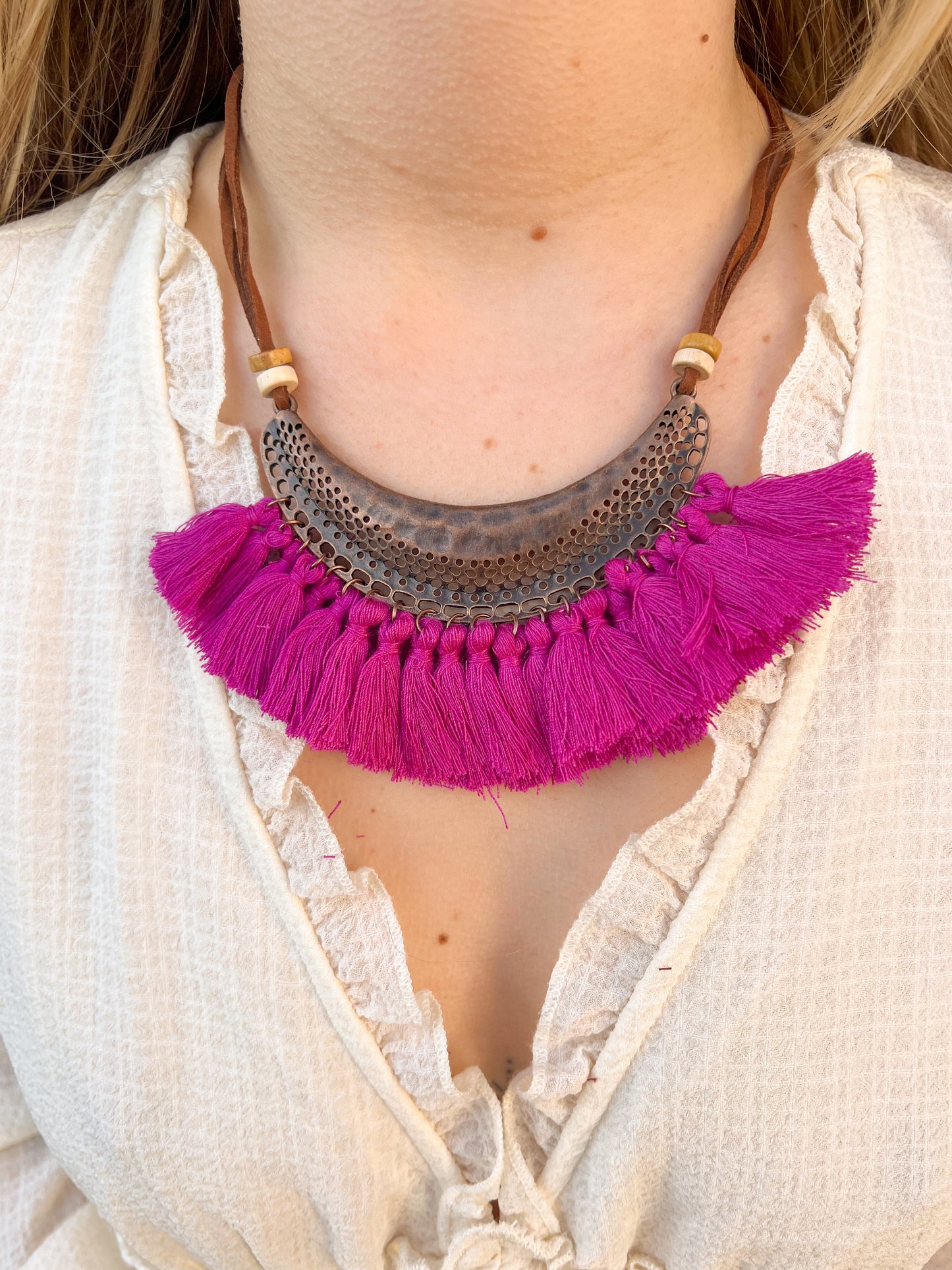 Collier pompons fushia